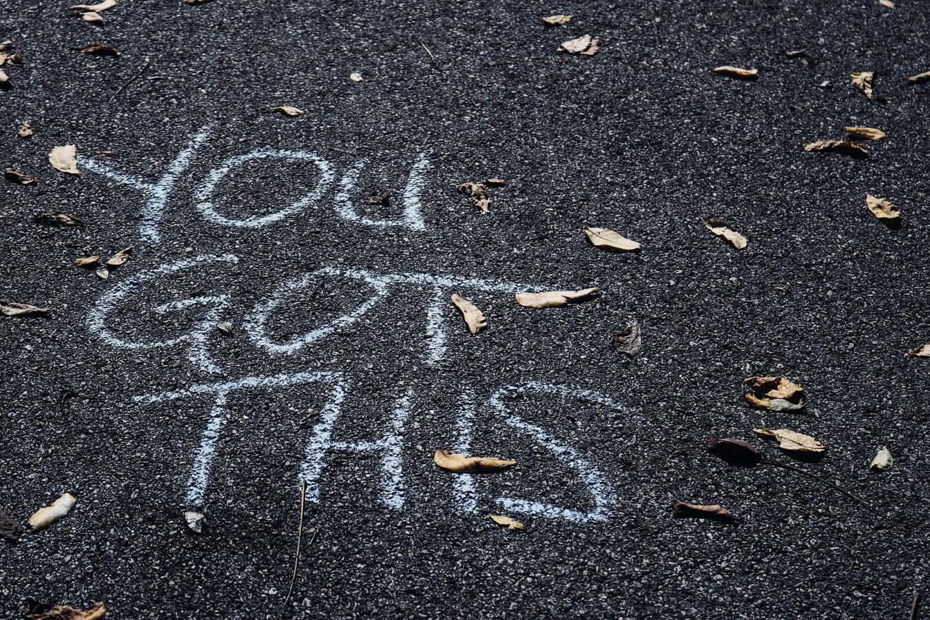 "YOU GOT THIS" written in large letters in chalk on the pavement